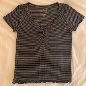 Thin white and black striped T-shirt; Size M